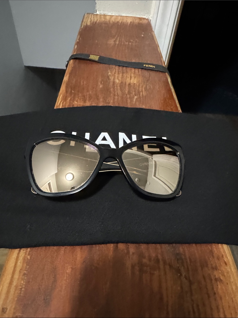 CHANEL Black Frame Sunglasses with Mirrored Lenses